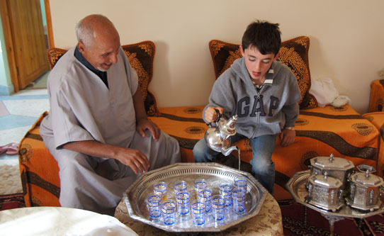 Morocco lunch in family home, pouring tea